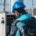 Engineer performing diagnostic checks on an industrial oxidizer control panel