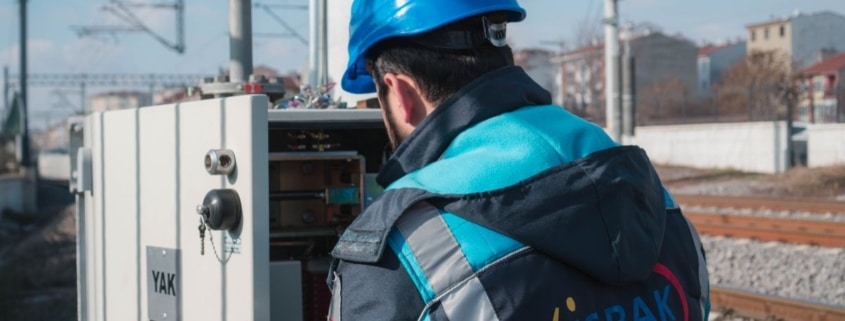 Engineer performing diagnostic checks on an industrial oxidizer control panel