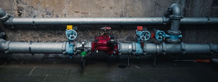 Industrial pipes and valves being connected during modular RTO commissioning