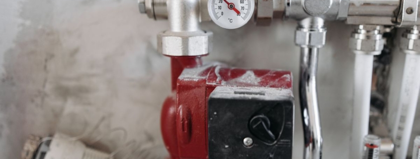 Industrial steel pipework with pressure gauge and safety valve on a thermal oxidizer